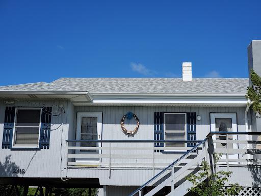 Roofing work on a building | Nansemond River Roofing & Siding