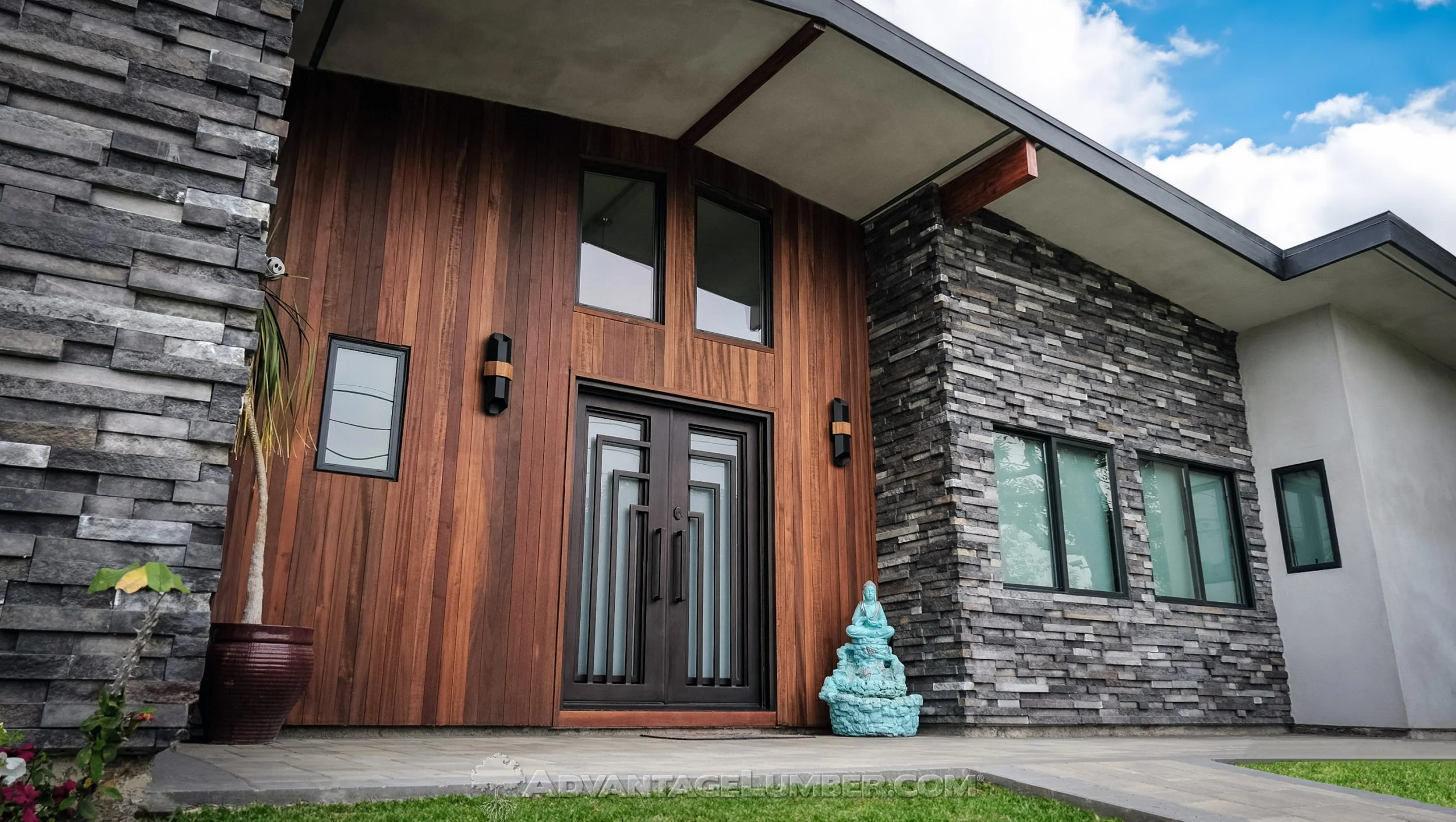 Vertical tigerwood siding on an exterior wall | Nansemond River Roofing & Siding
